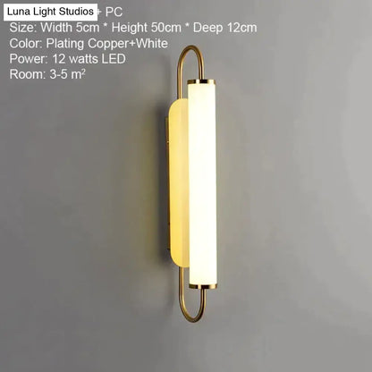 Copper-plated led wall lamp with sleek modern design featuring white diffuser and minimalist curved metal arms for bedroom use