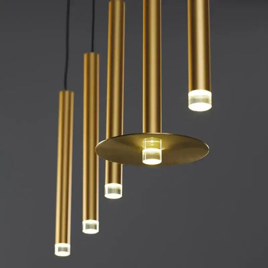 Modern minimalist gold tube led pendant lights with cylindrical design and warm led illumination for kitchen decorbites
