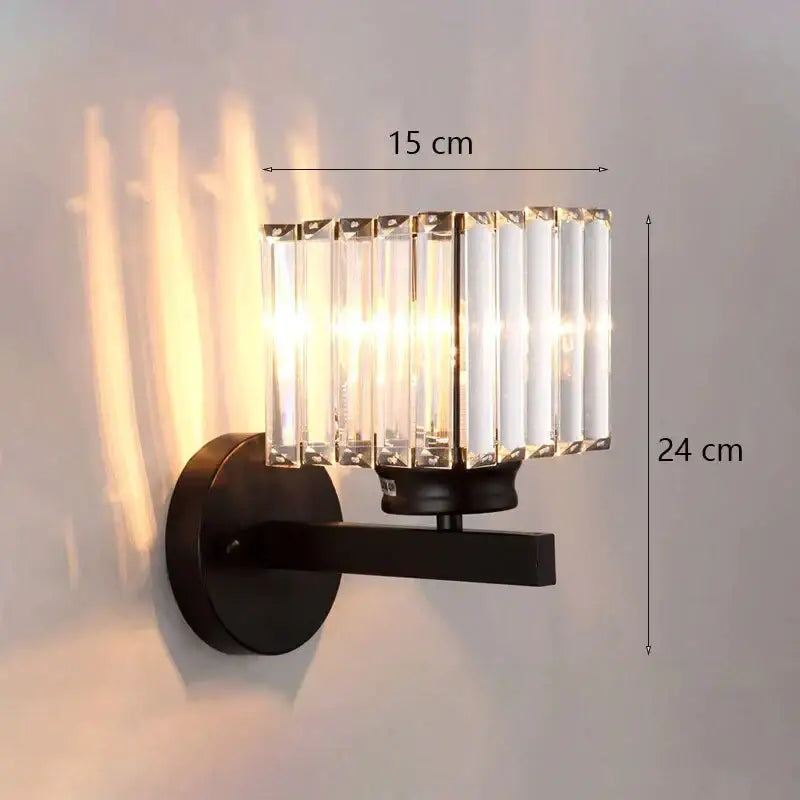 Modern minimalist black metal wall sconce with vertical crystal rods for a minimalist wall lamp in bedroom settings