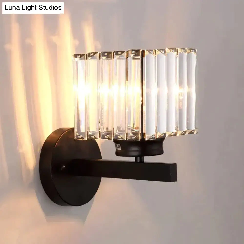 Modern minimalist wall lamp with black metal frame and vertical crystal rods for bedroom lighting