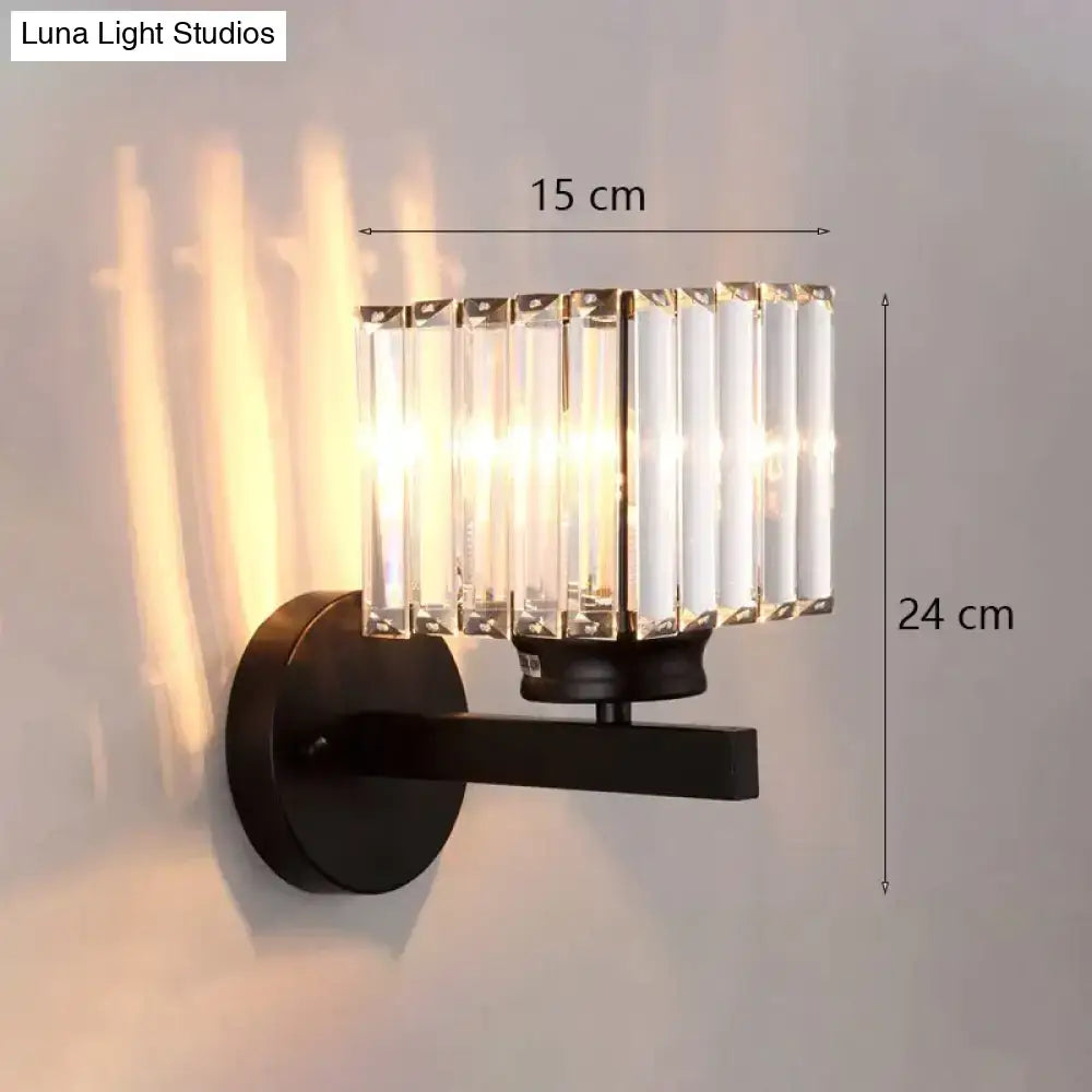 Modern minimalist black metal wall sconce with vertical crystal rods for elegant bedroom lighting