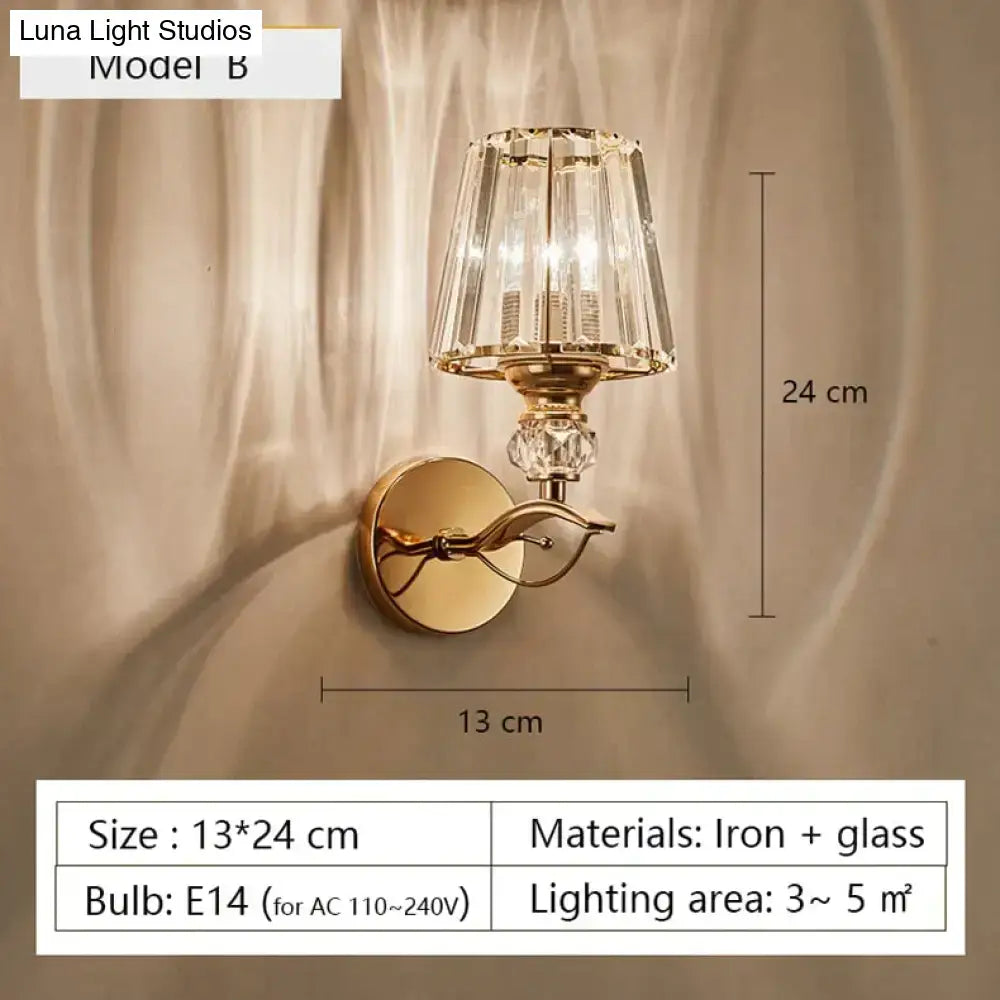 Modern minimalist gold wall lamp with faceted crystal shade and decorative glass elements for bedroom lighting