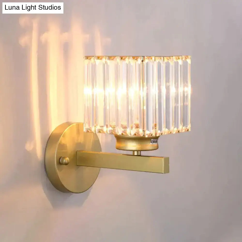 Modern minimalist gold wall lamp with rectangular crystal shade of vertical faceted glass rods for bedroom use