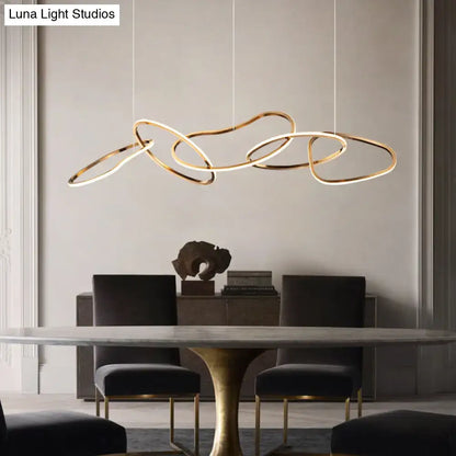Modern minimalist golden led hanging light with gold-toned interlocking rings and integrated led for dining room