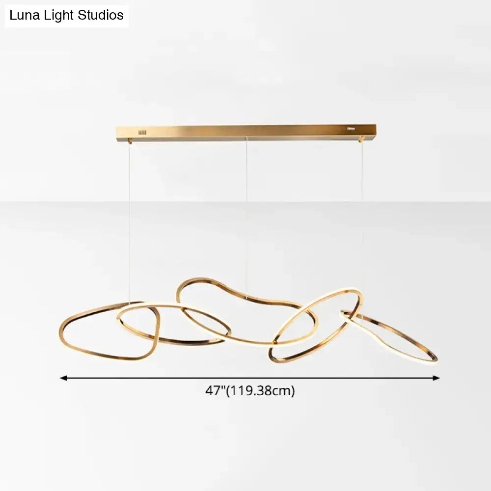 Modern minimalist golden led hanging light with interlocking circular rings and sleek rectangular ceiling mount for dining room