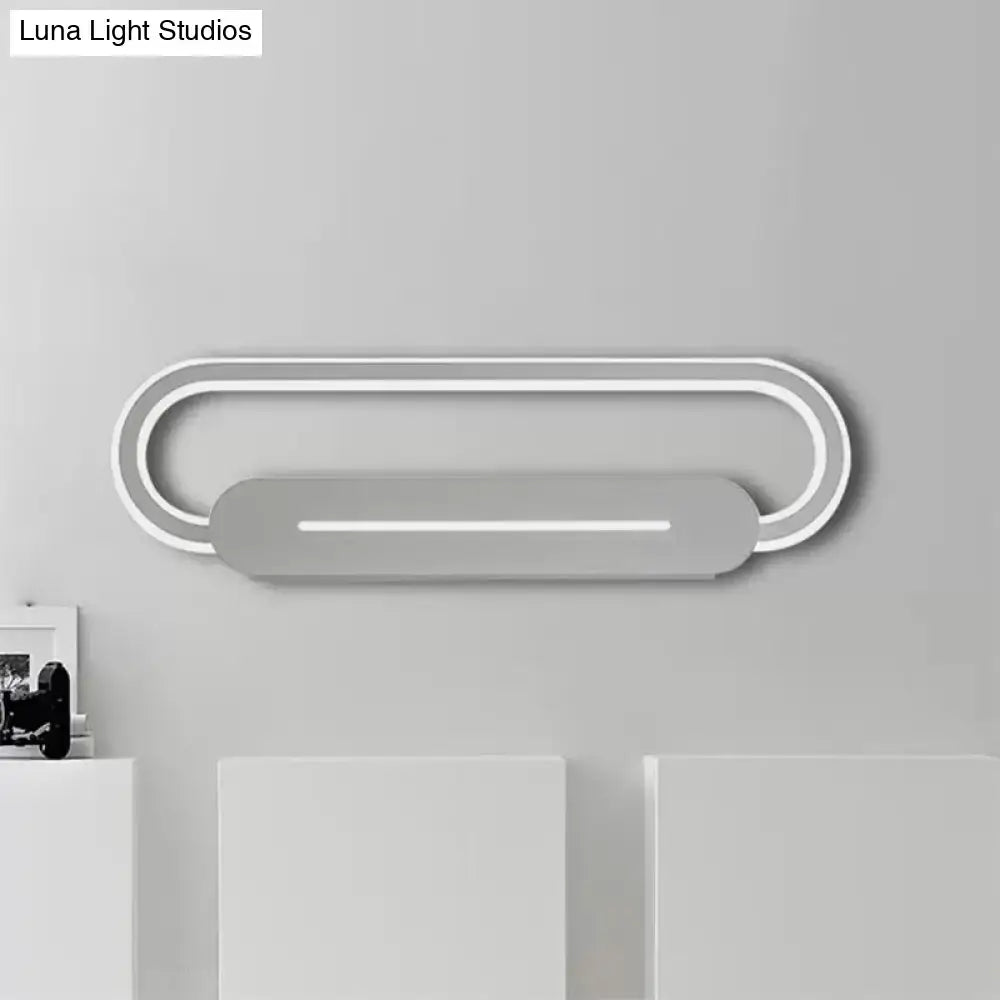 Modern minimalist gray acrylic oval led wall sconce with two concentric rings and central illuminated bar for bedroom lighting