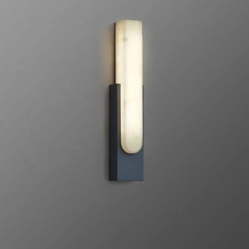 Modern minimalist grey metal wall sconce with sleek rectangular base and illuminated off-white alabaster diffuser decorbites grey metal