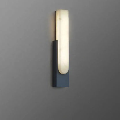 Modern minimalist grey metal wall sconce with sleek rectangular base and illuminated off-white alabaster diffuser decorbites grey metal