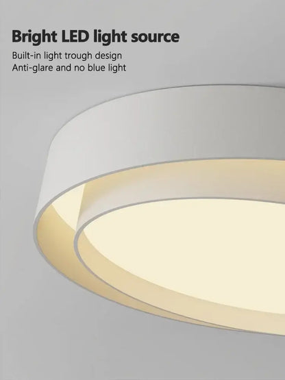 Modern minimalist white and black led ceiling light with sleek layered design and warm illumination for bedroom lighting