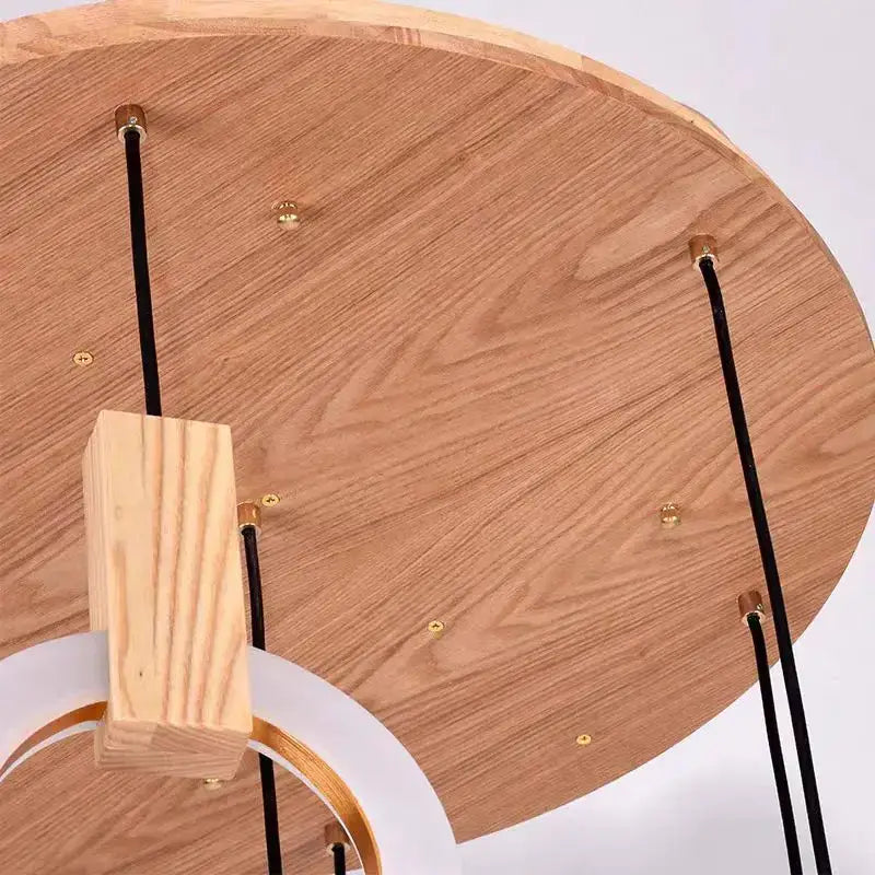 Lightweight wooden circular ceiling lights with black cords and gold hardware for modern minimalist led wooden staircase decorbites
