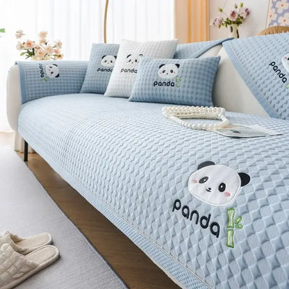 Modern minimalist light green quilted sofa cover with embroidered panda faces and bamboo motifs for living room use