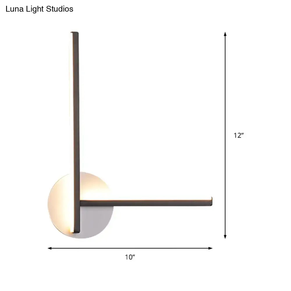 Modern minimalist linear wall light fixture with sleek black metal frame and warm LED light for bedroom use