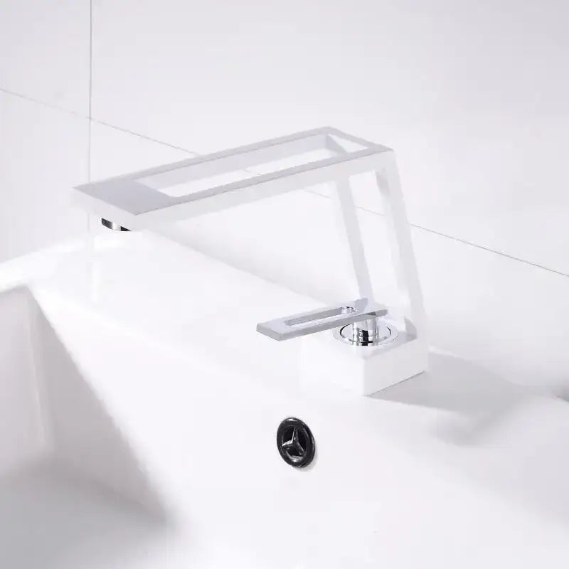 Modern white ceramic basin faucet with sleek chrome handle and spout in decorbites black brass basin design
