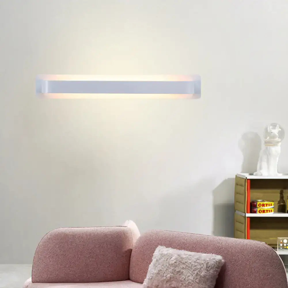 Modern minimalist silver linear wall lamp with a sleek white rectangular design for living room lighting
