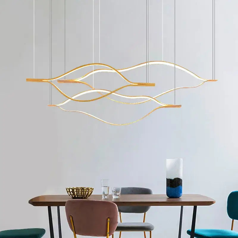 Modern minimalist white and bronze decorbites lip shaped chandelier with gold-toned wave pendant and integrated led lighting