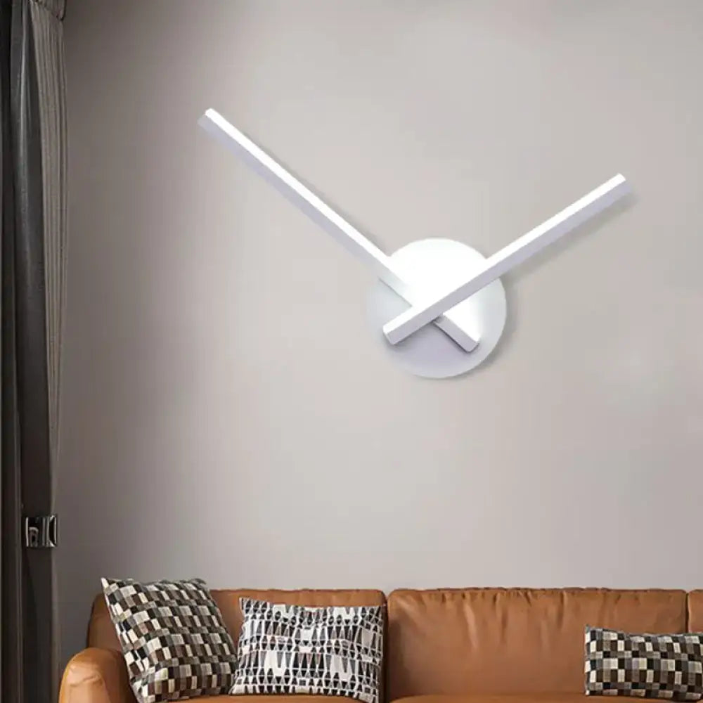 Minimalist white wall clock with sleek thin hands complements modern direct wired electric ceiling light with maximum bulb wattage