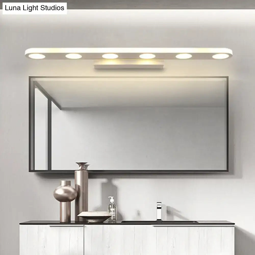 Modern rectangular bathroom mirror with sleek black frame paired with white finish acrylic shade vanity light
