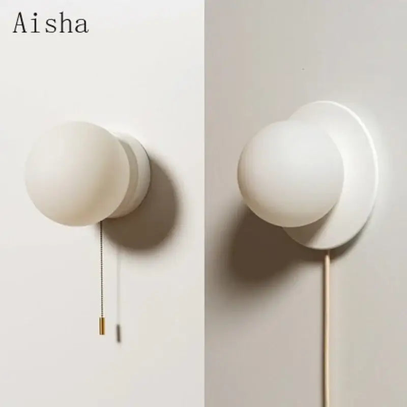 Modern minimalist white frosted glass ball wall light with spherical globe and circular base for bedroom wall light
