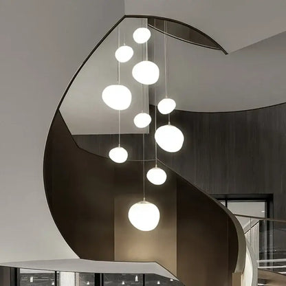 Modern minimalist white glass ball led pendant lights hanging in a cascading arrangement for living room decorbites glass ball