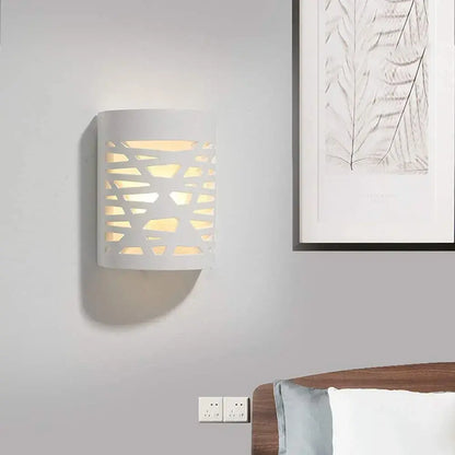 Modern minimalist white gypsum led wall lamp with geometric cutout pattern casting warm light for bedroom lighting wall lamp