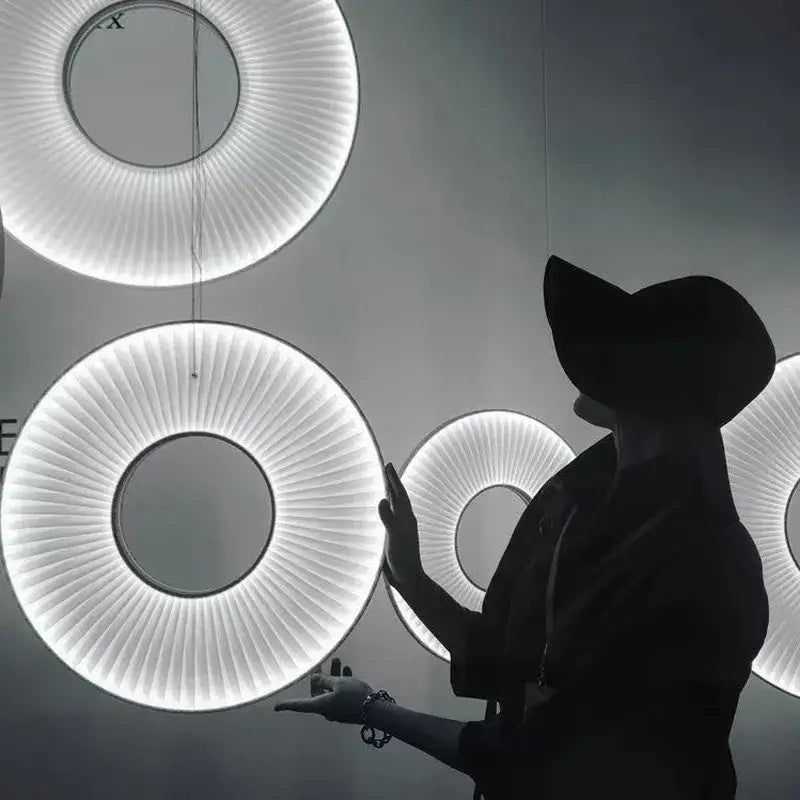 Modern minimalist white led pendant light with circular design and radiant white illumination for bedroom use