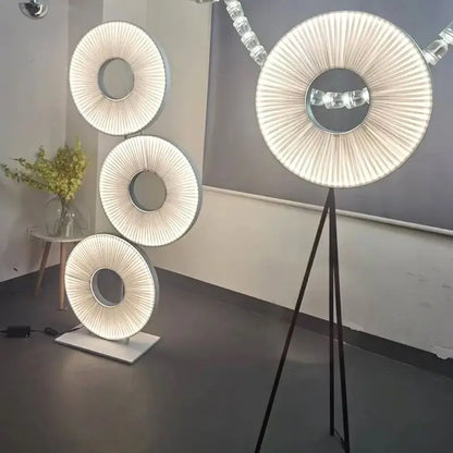Modern minimalist white led pendant light with circular pleated fabric shade and sleek metallic frame for bedroom use