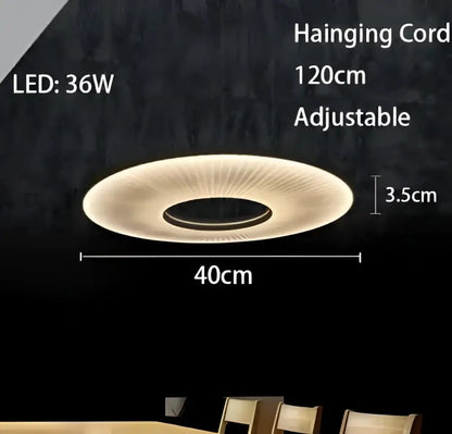 A modern minimalist white led pendant light with a circular warm glow and radial design for bedroom use