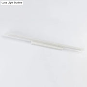 Modern minimalist white led vanity light fixture with sleek linear design for bathroom light fixture use