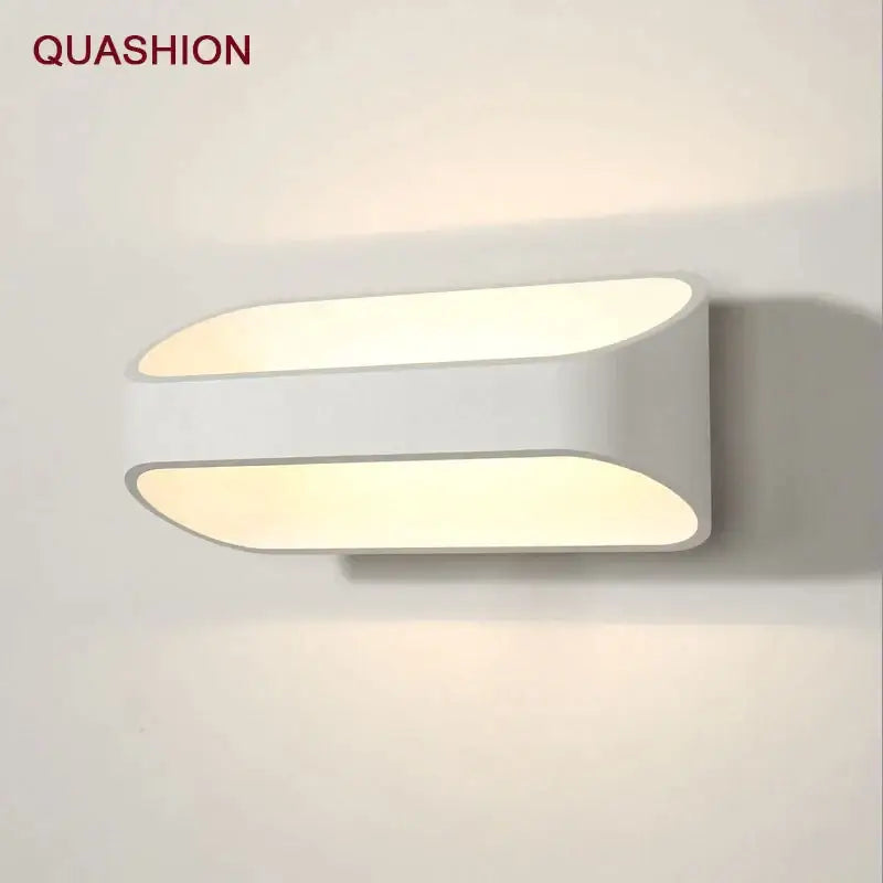 White quashion wall lamps with sleek oval led panels designed for modern minimalist bedroom and corridor lighting living space