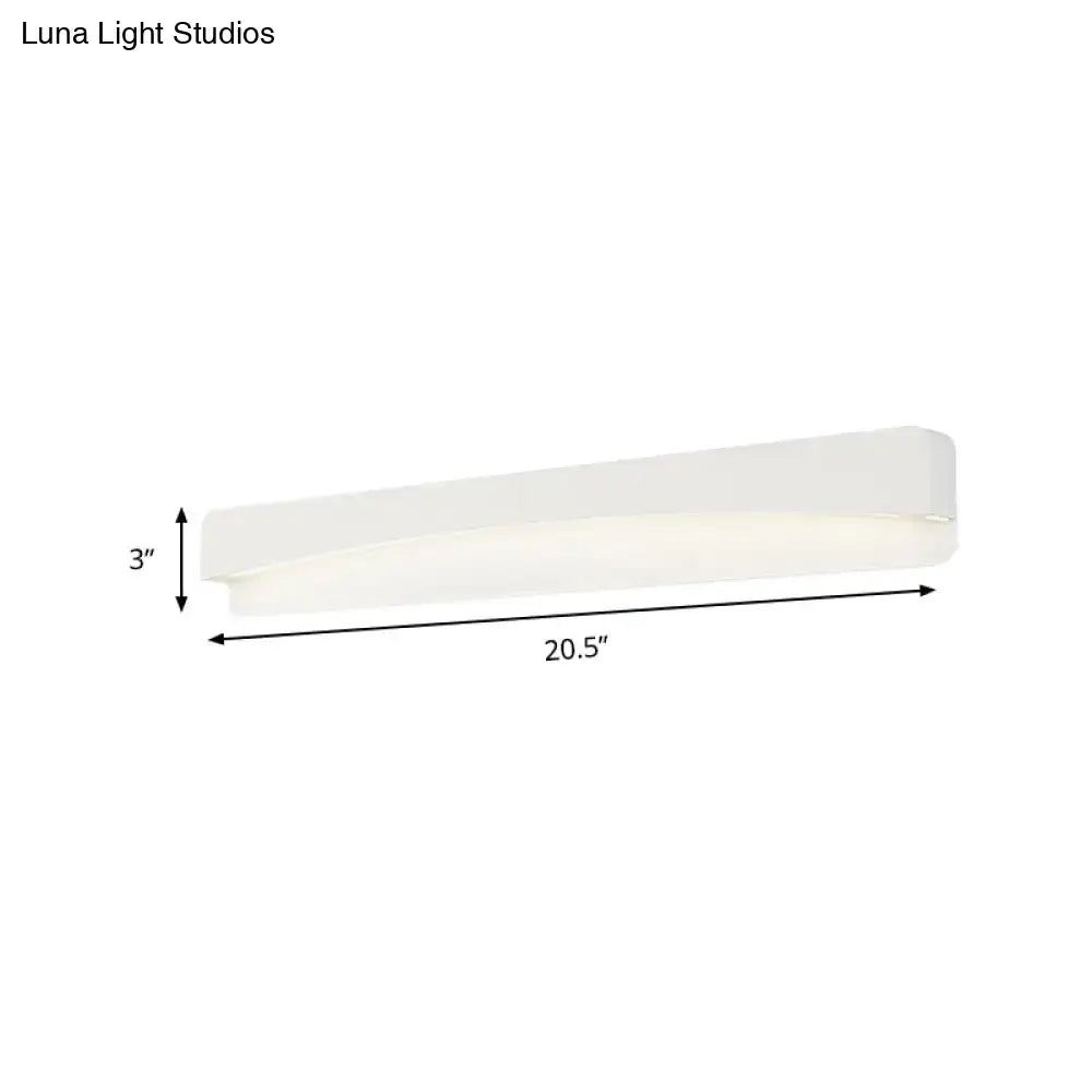 A sleek modern white rectangular wall sconce lamp with a minimalist matte finish for bedroom lighting