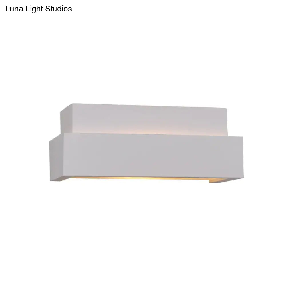 Modern minimalist white rectangular wall washer light with layered design providing warm ambient lighting for bedroom