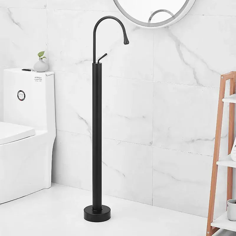 Black matte freestanding bathtub faucet with sleek curved spout for modern minimalist white standing bathtub design