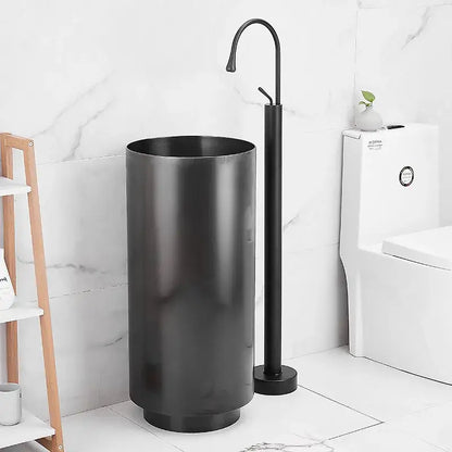 Black matte cylindrical pedestal sink with modern design paired with a white standing bathtub faucet curved spout