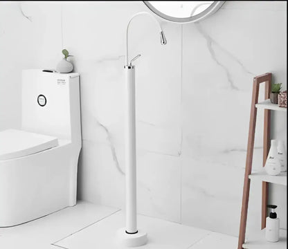 Modern minimalist white floor standing bathtub faucet with curved spout and freestanding shower head design