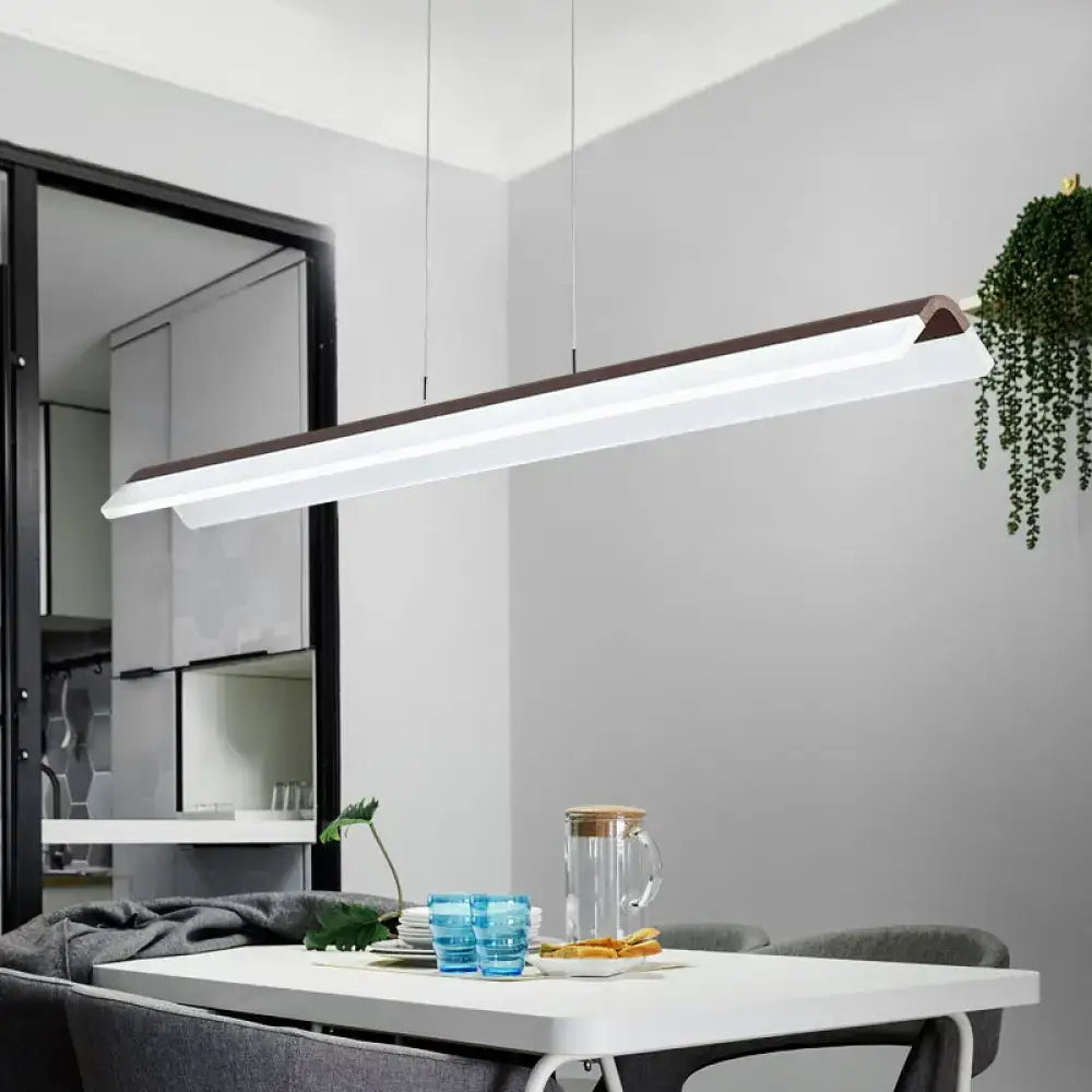 Modern minimalist pendant light fixture with sleek white and dark wood aluminum design for dining room by DecorBites™