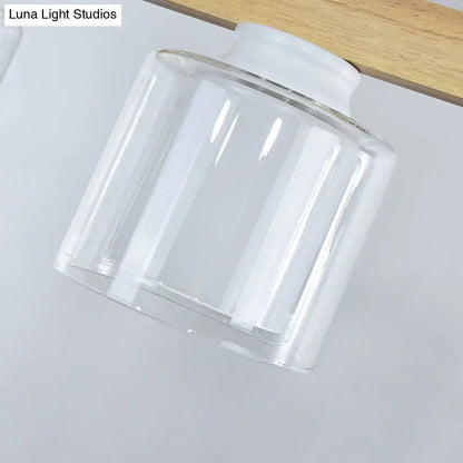 Clear glass lampshade with white plastic base for modern minimalist wood and white glass dining room pendant light