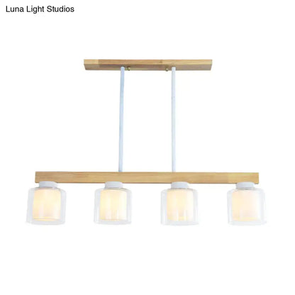 Modern minimalist wood pendant light with white glass shades designed for heads dining room illumination