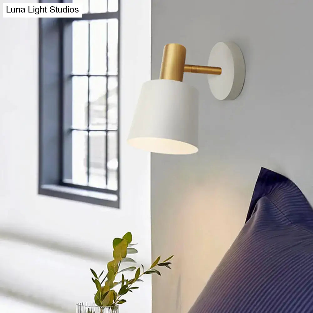 Modern wall mounted lamp with white matte finish and gold metal accents featuring a metal drum sconce design