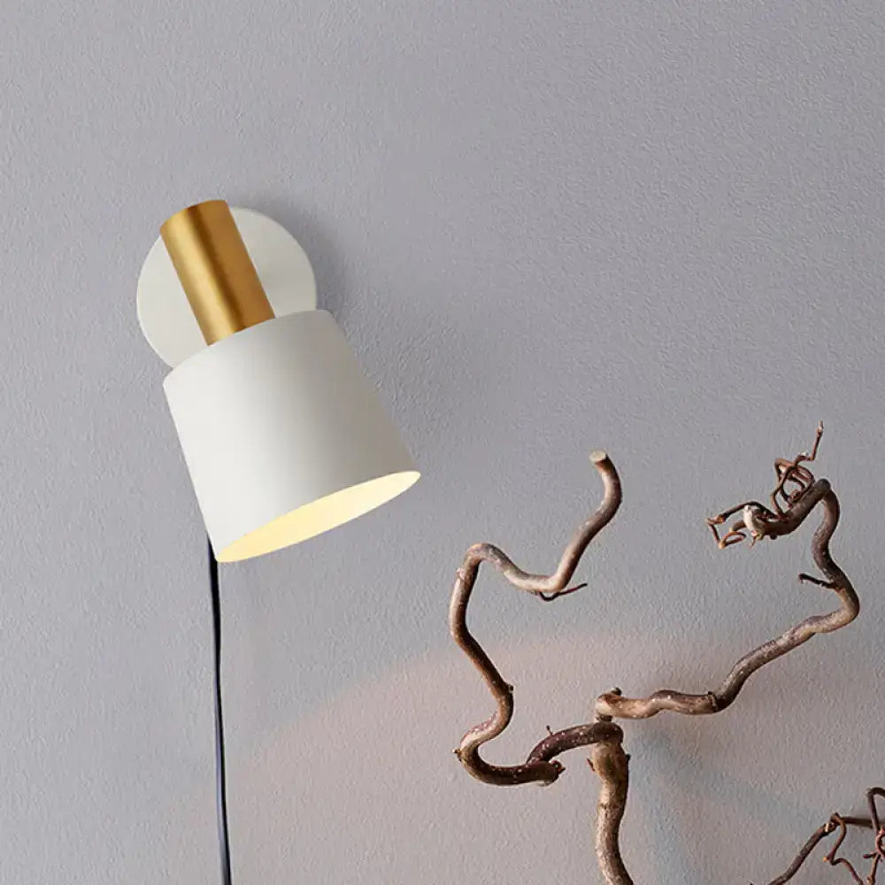 Modern mint green and gold metal drum sconce wall mounted lamp with a matte white cylindrical shade and polished gold base