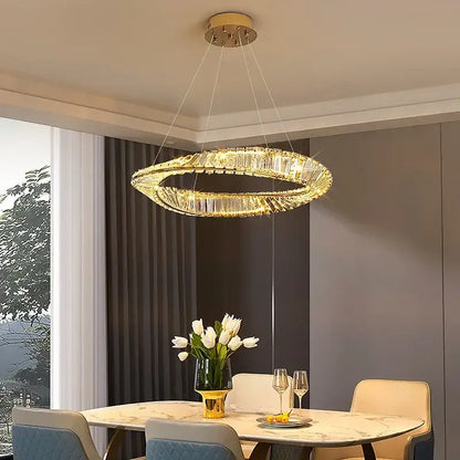 A modern multi tier gold decorbites crystal led chandelier with circular design for dining room lighting
