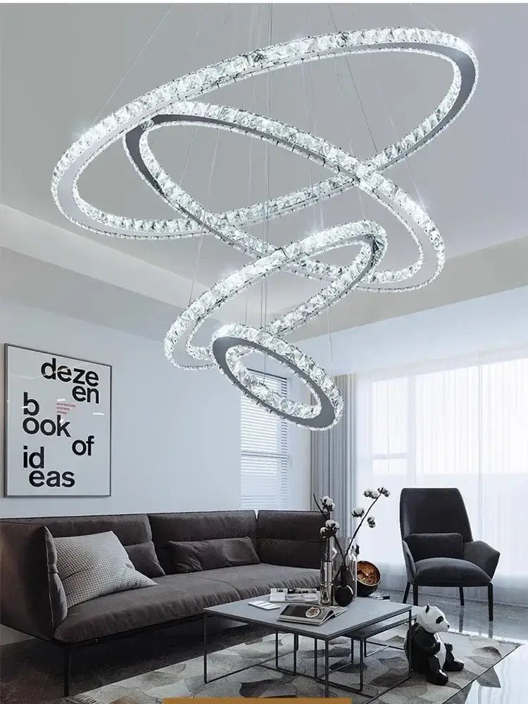 Modern multi tiered chrome rings led chandelier with interlocking crystal rings for elegant living room decorbites lighting