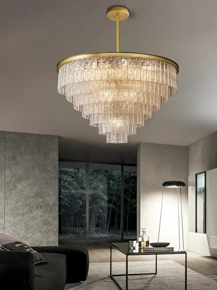 A modern multi tiered gold elegant crystal glass chandelier with cascading textured clear glass for dining room decorbites elegant crystal