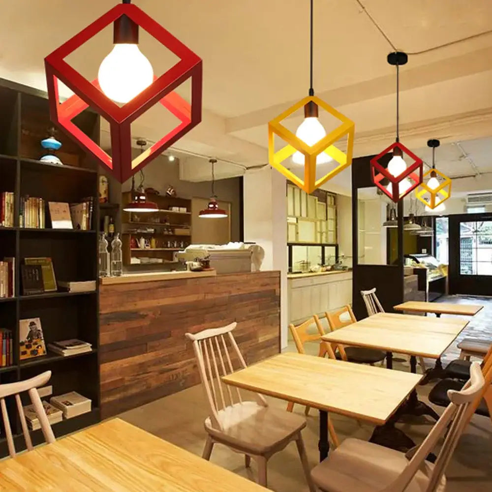 Modern multicolor geometric cube pendant lights with red and yellow exposed bulb interiors for kitchen decorbites decor