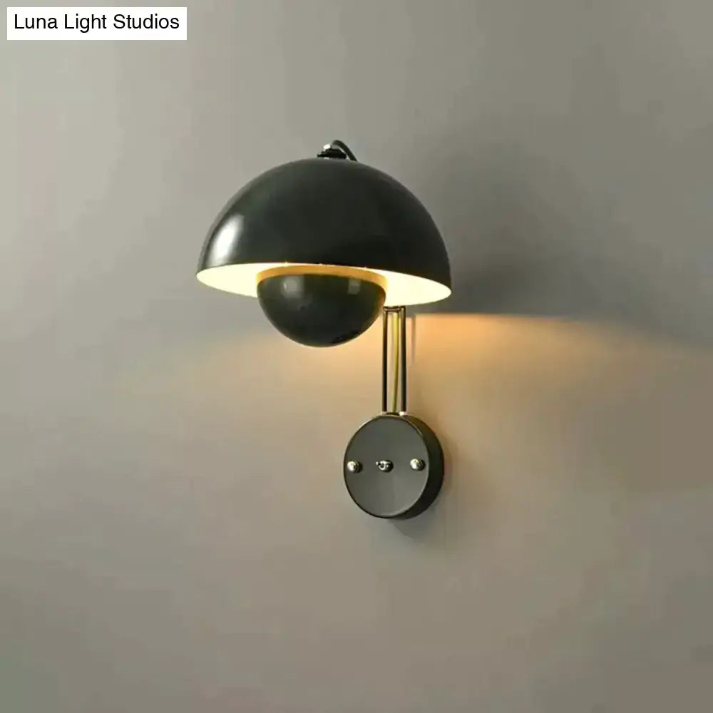 Black matte wall lamp with modern dome shade and brass base type finish for bedroom use