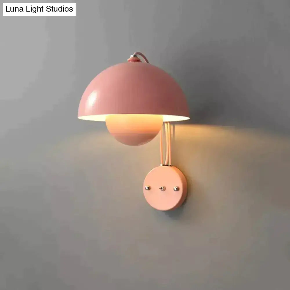 Pastel pink metallic modern mushroom wall lamp with brass base type and dome-shaped shade for bedroom lighting