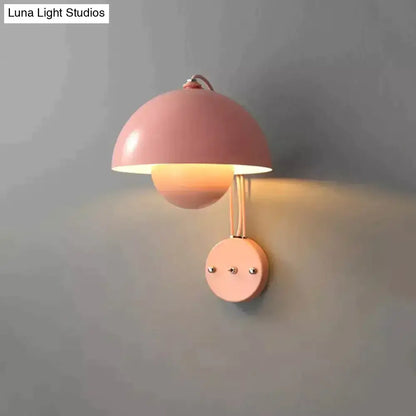 Pastel pink metallic modern mushroom wall lamp with dome-shaped shade and brass circular base type finish