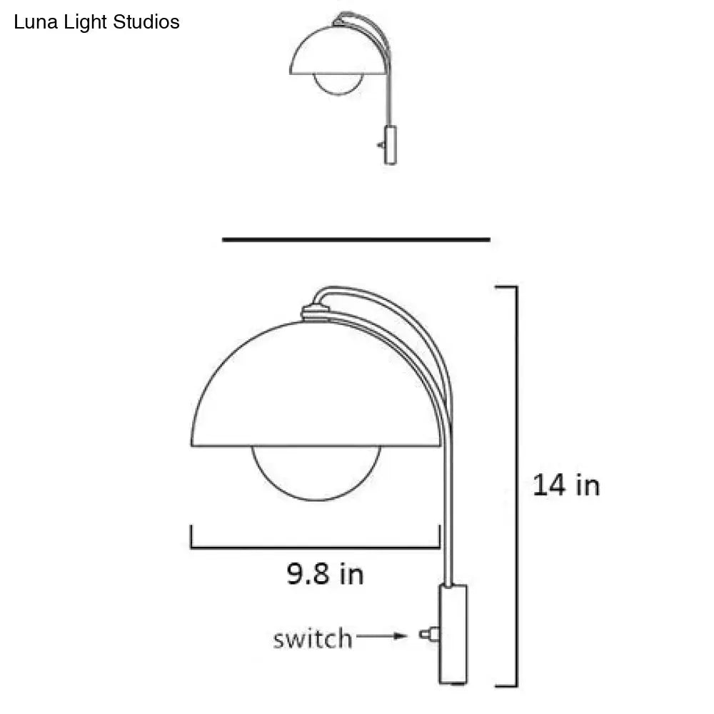 Modern mushroom wall lamp with brass base type features a sleek curved arm and dome-shaped shade for bedroom use