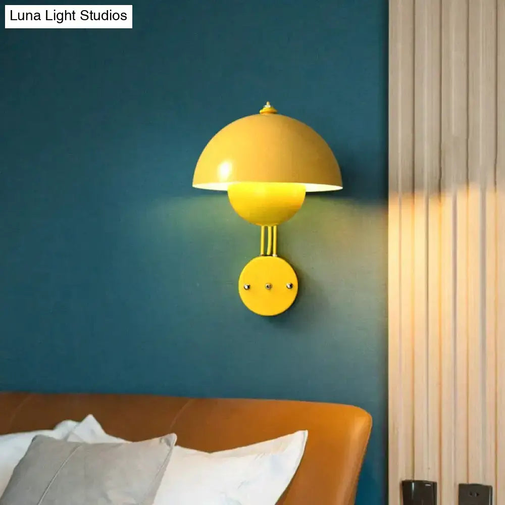 Vibrant yellow modern mushroom wall lamp with brass base type and sleek metallic finish for bedroom use