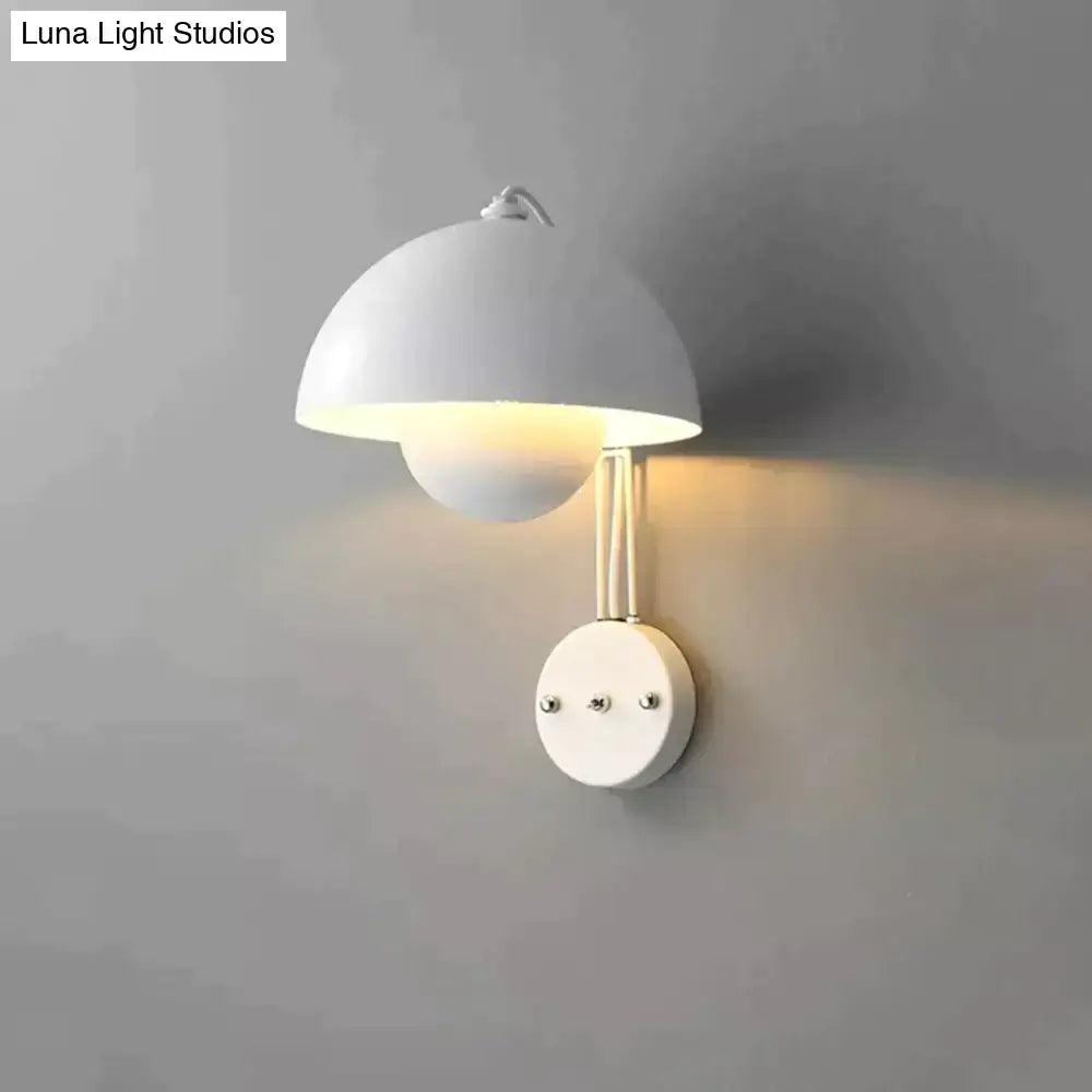 White minimalist wall lamp with dome-shaped shade and brass circular base type for modern bedroom use