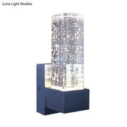 Modern navy and clear crystal bubble wall sconce with rectangular design and navy blue mounting base for bedroom wall lamp
